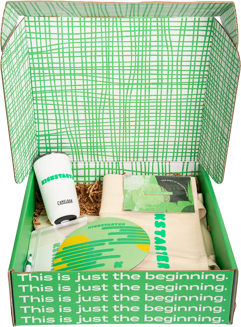 Green box full of onboarding swag for new employees.