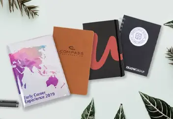 4 notebooks customized with company logos